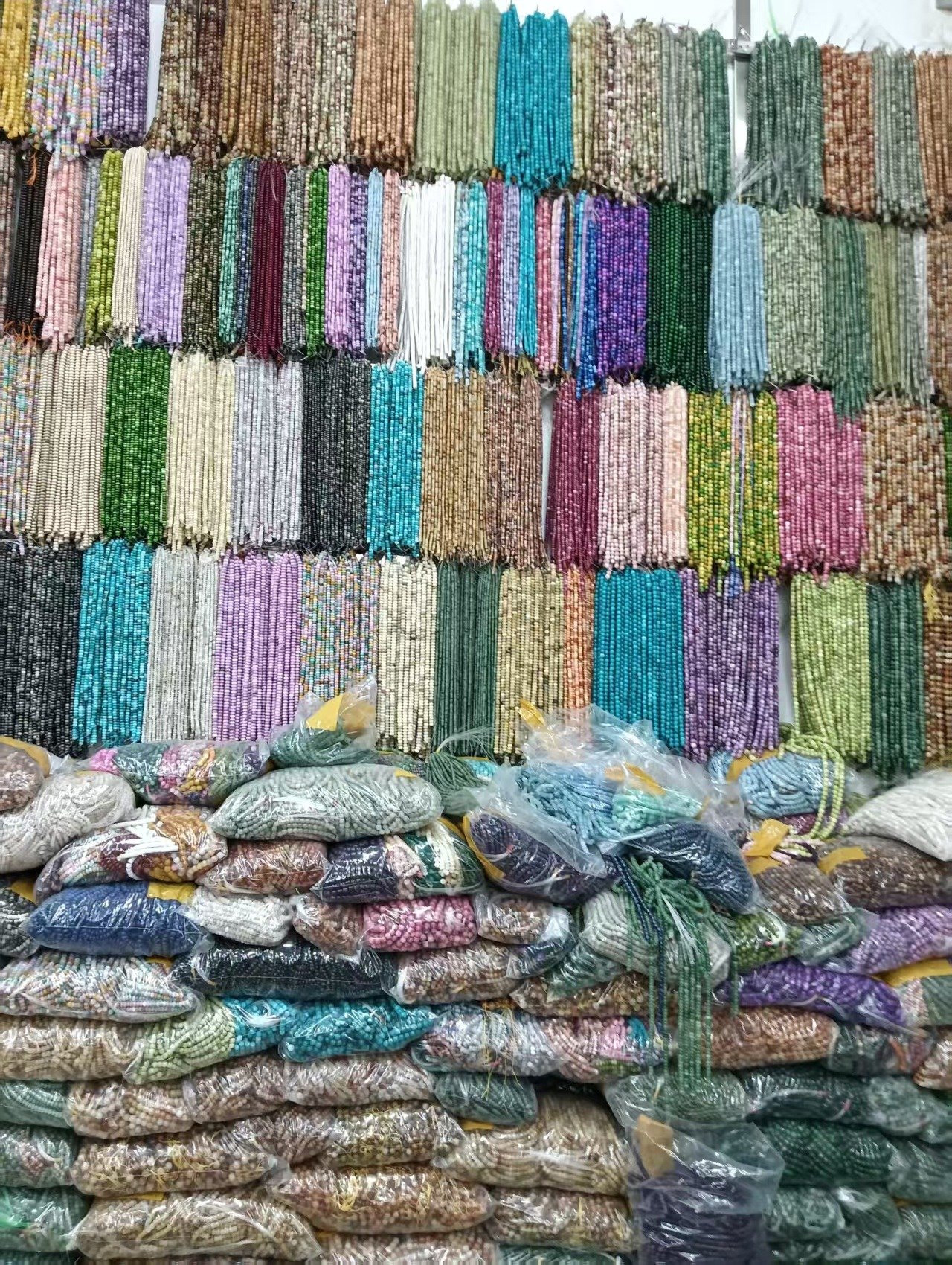 Jewelry beads and stone strands at a Yiwu material sourcing point
